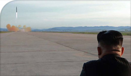 Kim Jong Un looks at missile launch in undated photo from National Post | 2017-10-14