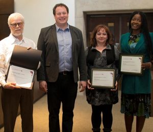 Image of award winners and Interim Dean